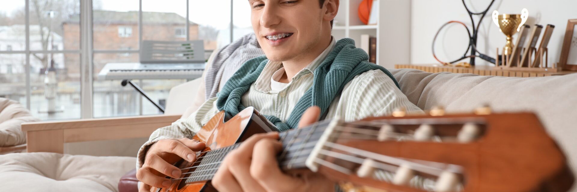 Young person playing guitar