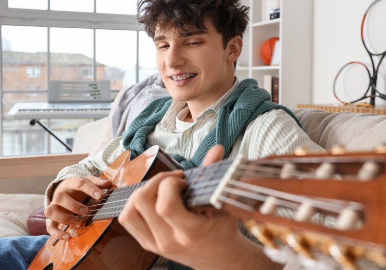 Young person playing guitar