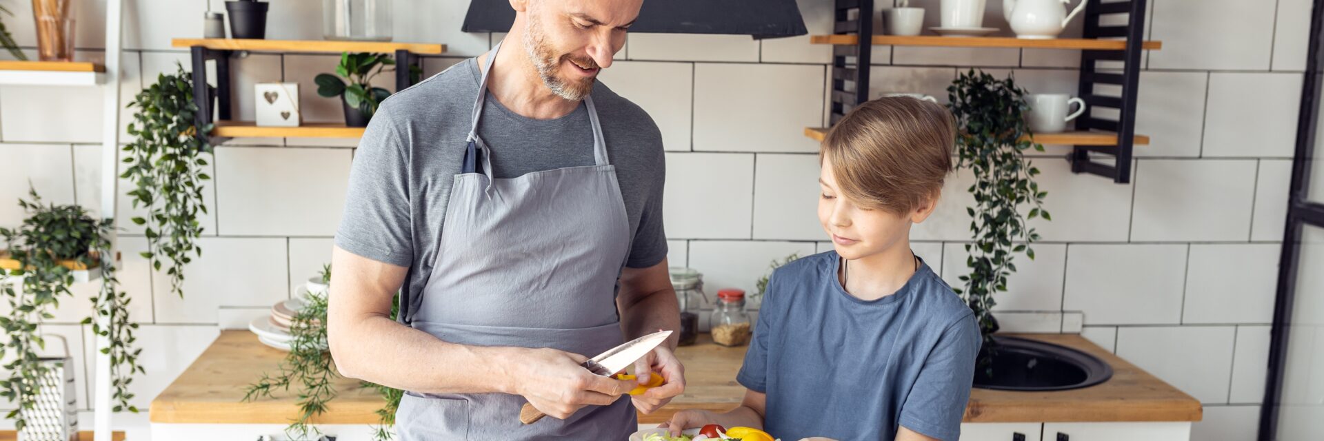 Young person and support worker in kitchen